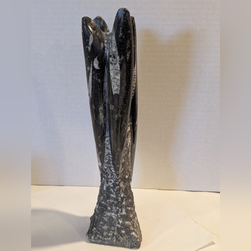 Orthoceras fossil sculpture. An extinct "straight-shelled" cephalopod.
